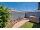 Private backyard featuring a walkway, air conditioning unit and well-maintained garden area at 13261 N 110Th Ave, Sun City, AZ 85351