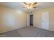 Neutral bedroom featuring new carpets, ceiling fan and two separate closets at 13261 N 110Th Ave, Sun City, AZ 85351