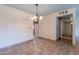 Traditional dining room with tile flooring and chandelier lighting at 13261 N 110Th Ave, Sun City, AZ 85351