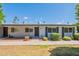 Charming single-story home with landscaped front yard and blue sky at 13261 N 110Th Ave, Sun City, AZ 85351