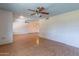 Spacious living room with ceiling fans and ample natural light at 13261 N 110Th Ave, Sun City, AZ 85351