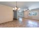 Bright living area with neutral walls, tile flooring and modern ceiling fan at 13261 N 110Th Ave, Sun City, AZ 85351