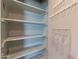 Pantry with custom shelving and extra storage at 13261 N 110Th Ave, Sun City, AZ 85351