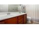 Bathroom with double sinks, stylish fixtures, and a shower and bathtub combo at 14921 W Luna S Dr, Litchfield Park, AZ 85340