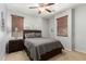 Cozy bedroom featuring a comfortable queen-size bed and ambient lighting at 14921 W Luna S Dr, Litchfield Park, AZ 85340