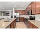 Well-equipped kitchen featuring stainless steel appliances and a granite island and countertops at 14921 W Luna S Dr, Litchfield Park, AZ 85340