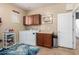 Functional laundry room with cabinets, a utility sink, and included washer and dryer at 14921 W Luna S Dr, Litchfield Park, AZ 85340