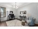 Inviting living room area featuring a white rug, modern furniture, and stylish decor at 14921 W Luna S Dr, Litchfield Park, AZ 85340