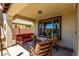 Covered patio furnished with comfortable seating, perfect for outdoor relaxation and entertainment at 14921 W Luna S Dr, Litchfield Park, AZ 85340