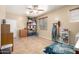 Spacious storage room featuring ample shelving and a ceiling fan for convenience at 14921 W Luna S Dr, Litchfield Park, AZ 85340