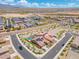 Community aerial view of a home with a private pool, landscaped backyard, and beautiful mountain views in the distance at 15663 S 183Rd Dr, Goodyear, AZ 85338