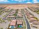 An aerial neighborhood shot featuring residential homes with pools and landscaped yards in a desert community at 15663 S 183Rd Dr, Goodyear, AZ 85338