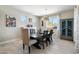 Comfortable dining area with modern furnishings and window offering natural light, adjacent to a small hutch at 15663 S 183Rd Dr, Goodyear, AZ 85338