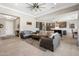 Spacious living room open to kitchen featuring tile floors and comfortable seating at 15663 S 183Rd Dr, Goodyear, AZ 85338