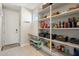Walk-in pantry filled with shelves for food storage and organization, plus a utility sink at 15663 S 183Rd Dr, Goodyear, AZ 85338