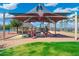A modern playground with sunshade is perfect for children in this beautiful lake community at 15663 S 183Rd Dr, Goodyear, AZ 85338
