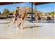 Fun splash pad area perfect for children with interactive water features and lounge chairs at 15663 S 183Rd Dr, Goodyear, AZ 85338