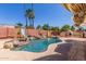 Backyard with a pool, two water slides, mature landscaping, and an outdoor fireplace at 15825 N 45Th St, Phoenix, AZ 85032