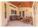 Covered patio with exposed wood ceiling and features casual seating at 15825 N 45Th St, Phoenix, AZ 85032