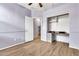 Bedroom with ceiling fan, laminate flooring, closet, and bonus built-in desk with storage at 18286 La Posada Ct, Gold Canyon, AZ 85118
