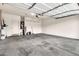 Spacious two car garage offering ample room for storage with water heater, overhead shelving, and utility sink at 18286 La Posada Ct, Gold Canyon, AZ 85118