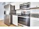Modern kitchen featuring stainless steel appliances, granite countertops, and white subway tile backsplash at 18286 La Posada Ct, Gold Canyon, AZ 85118