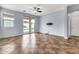 Inviting living room with tile flooring, access to the backyard pool, and neutral wall colors at 18286 La Posada Ct, Gold Canyon, AZ 85118