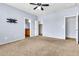 Generously sized primary bedroom offering plush carpet, ensuite access, and walk-in closet at 18286 La Posada Ct, Gold Canyon, AZ 85118