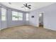 Spacious primary bedroom features plush carpeting and abundant natural light from large windows at 18286 La Posada Ct, Gold Canyon, AZ 85118