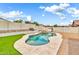Backyard featuring a free form pool surrounded by rock landscape at 18286 La Posada Ct, Gold Canyon, AZ 85118