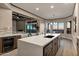 Beautiful kitchen with stainless steel appliances, wine cooler, a large island, and custom cabinetry at 18401 N 14Th St, Phoenix, AZ 85022
