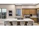 Kitchen with stainless steel appliances, a large kitchen island with seating, and custom cabinetry at 18401 N 14Th St, Phoenix, AZ 85022