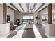 Bright, open living room with a fireplace, wood beams, large windows and wood flooring at 18401 N 14Th St, Phoenix, AZ 85022