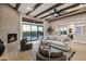 Inviting living room with stylish furnishings, a cozy fireplace, and sliding glass doors to a patio and pool at 18401 N 14Th St, Phoenix, AZ 85022