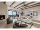 Spacious living room with beamed ceilings, fireplace, and sliding glass doors to an outdoor area at 18401 N 14Th St, Phoenix, AZ 85022