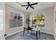 Bright office space featuring a modern ceiling fan and a view of the backyard basketball court at 18401 N 14Th St, Phoenix, AZ 85022