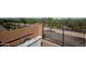 Wrought iron fencing surrounds the property with a brick wall separating the area behind the pool at 20210 N Wagner Wash Dr, Buckeye, AZ 85396