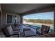This backyard with stone flooring includes a pool and stylish outdoor seating at 20210 N Wagner Wash Dr, Buckeye, AZ 85396