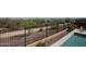 The backyard includes desert landscaping and secure wrought iron fencing, offering privacy and security at 20210 N Wagner Wash Dr, Buckeye, AZ 85396