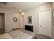 Well-lit bedroom with neutral paint, tiled floors, recessed lighting, windows, and furniture at 20210 N Wagner Wash Dr, Buckeye, AZ 85396