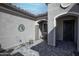 Cozy courtyard with stylish pavers, an outdoor dining set, and textured stucco walls, perfect for relaxing at 20210 N Wagner Wash Dr, Buckeye, AZ 85396