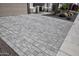 Long driveway featuring attractive pavers and desert landscaping that enhances the home's curb appeal at 20210 N Wagner Wash Dr, Buckeye, AZ 85396