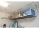 Overhead garage storage racks provide an organized solution for storing bins and boxes off the floor at 20210 N Wagner Wash Dr, Buckeye, AZ 85396