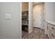 Hallway featuring a pantry with shelving, a closet, and access to other rooms at 20210 N Wagner Wash Dr, Buckeye, AZ 85396