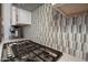 Kitchen cooktop featuring a Thermador stainless steel gas range and decorative tile backsplash at 20210 N Wagner Wash Dr, Buckeye, AZ 85396