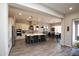 Spacious kitchen with stainless appliances, an island, and a connecting dining area at 20210 N Wagner Wash Dr, Buckeye, AZ 85396