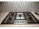 Kitchen cooktop featuring a Thermador stainless steel gas range and decorative tile backsplash at 20210 N Wagner Wash Dr, Buckeye, AZ 85396