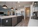 Bright kitchen featuring modern appliances, gray island, and an open layout at 20210 N Wagner Wash Dr, Buckeye, AZ 85396