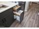 Smart kitchen design features a convenient pull-out trash receptacle, maximizing space and functionality at 20210 N Wagner Wash Dr, Buckeye, AZ 85396