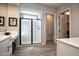 Bright main bathroom showcasing a walk-in shower and modern vanity with clean lines at 20210 N Wagner Wash Dr, Buckeye, AZ 85396